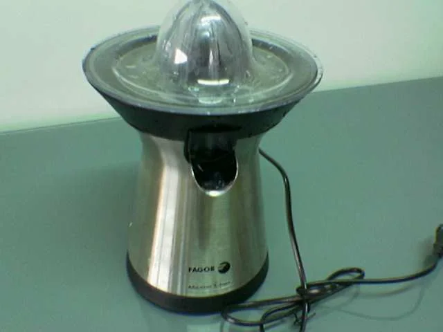 Fagor electric citrus press with a cone, round strainer and front spout