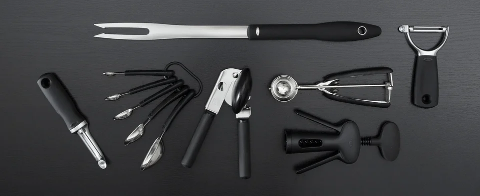 OXO kitchen tools including straight and Y-shaped peelers and a handled manual can opener
