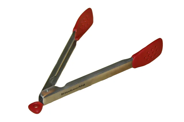 Open metal kitchen tongs with red coated tips and a red locking tab